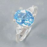 A 925 silver ring set with an oval cut blue topaz and pear cut white stones, (N.5).