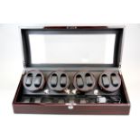 A large 8 watch automatic watch winding case by Xtelary, 64 x 27 x 23cm.