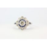 A pretty 18ct white gold ring set with a centre diamond 0.44ct with further diamonds and