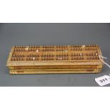 An unusual 19th century fixed peg cribbage score board by H. Brooks & Co, 28 x 9 x 5cm.