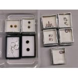 A quantity of silver stone set pendants, earrings, etc.