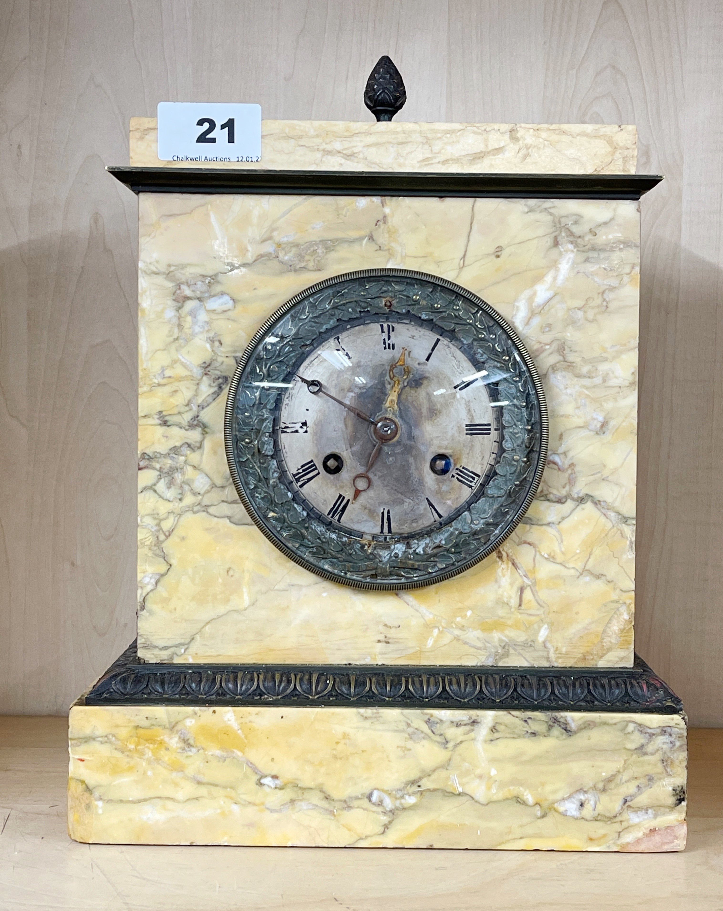 An early 19th century sienna marble and brass mantle clock with silk suspension, 31 x 22cm.
