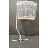 A contemporary bird cage and metal stand cage size 63 x 34 x 60cm.