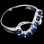 A 925 silver sapphire set infinity shaped ring, (K).