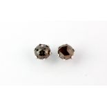 A pair of 18ct white gold stud earrings set with faceted cut natural brown diamonds, approx. 1.