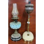 A Victorian oil lamp and Victorian kerosene lamp.