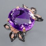 A 925 silver ring set with a large oval cut amethyst, (P.5), amethyst 2 x 1.8cm.