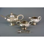 A superb early 20th century Chinese silver tea set by Luen Wo, relief decorated with dragons, with