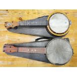 Two cased banjos.
