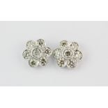 An impressive pair of 18ct white gold daisy cluster earrings set with 3ct brilliant cut diamonds, L.