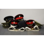 A quantity of military and other hats etc.