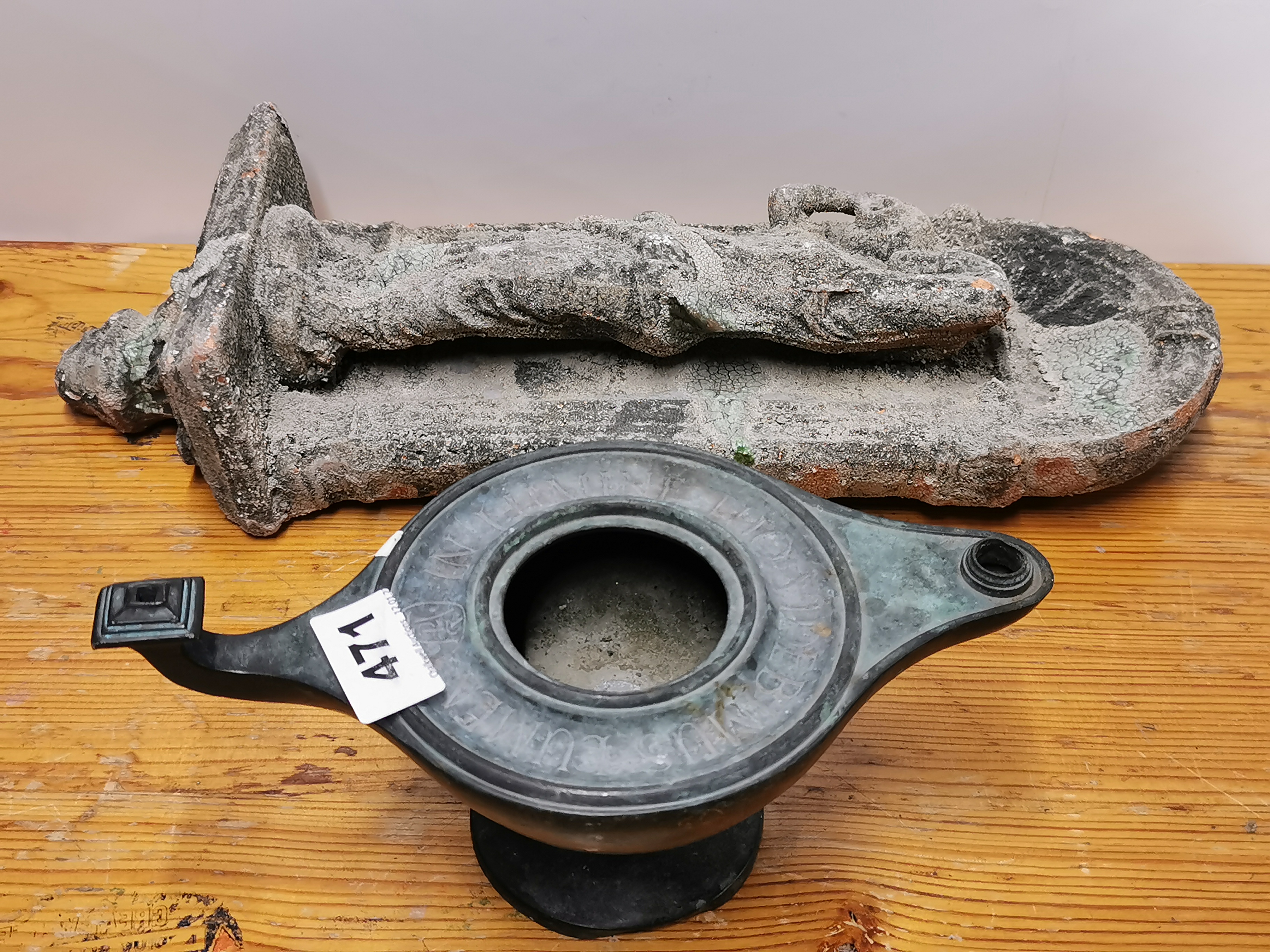 A bronze oil lamp and a terracotta wall figure, wall figure H. 39cm. - Image 2 of 2