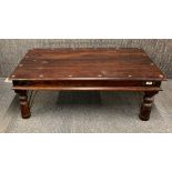 A mahogany veneered low coffee table, 110 x 61 x 39cm.