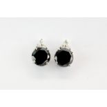 A pair of 18ct white gold stud earrings set with round cut black diamonds, approx. 3.3ct overall,