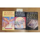 Three first edition Harry Potter books including rare misprint version of "Half blood prince"