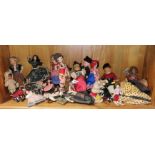 A collection of vintage dolls and toys.