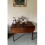 A 19th century mahogany drop leaf table with single drawer, 92 x57cm extending to 107cm.