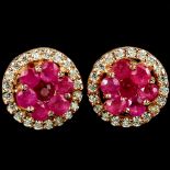 A pair of 925 silver rose gold gilt earrings set with rubies and white stones, Dia. 1.1cm.