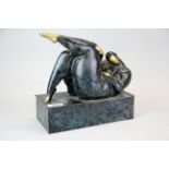 An interesting patinated bronze/brass sculpture of a naked woman, 25 x 12 x 25cm.