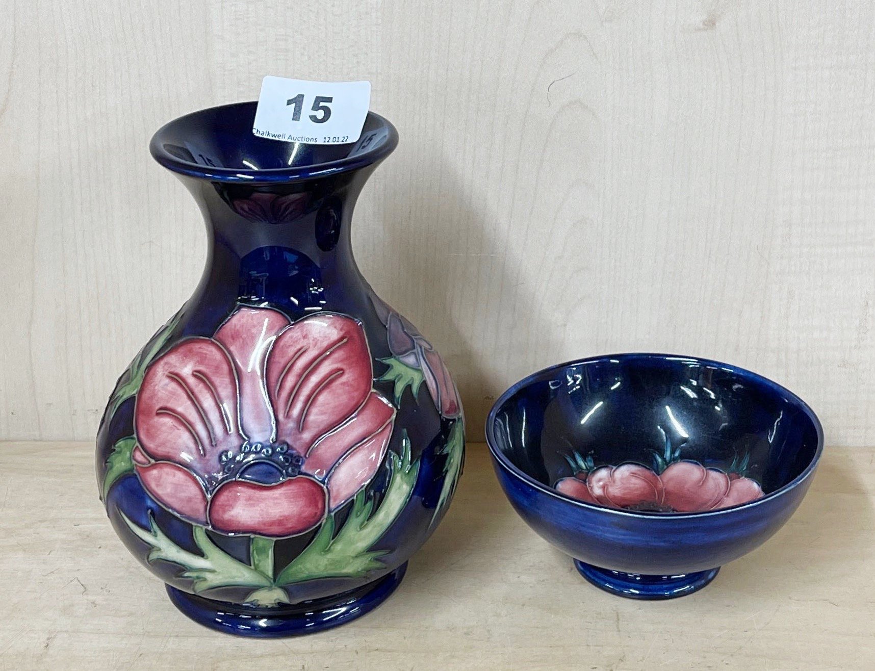 A Moorcroft blue anemone vase, H. 16cm. Together with an anemone bowl.