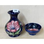 A Moorcroft blue anemone vase, H. 16cm. Together with an anemone bowl.