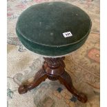 A 19th century carved mahogany piano stool.