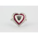 A superb 18ct white gold heart shaped ring set with a centre diamond 2.1ct surrounded by rubies