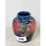 A small Moorcroft berry vase, H. 9cm.