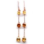 A pair of 925 silver rose gold gilt drop earrings set with citrines and white stones, L. 7cm.