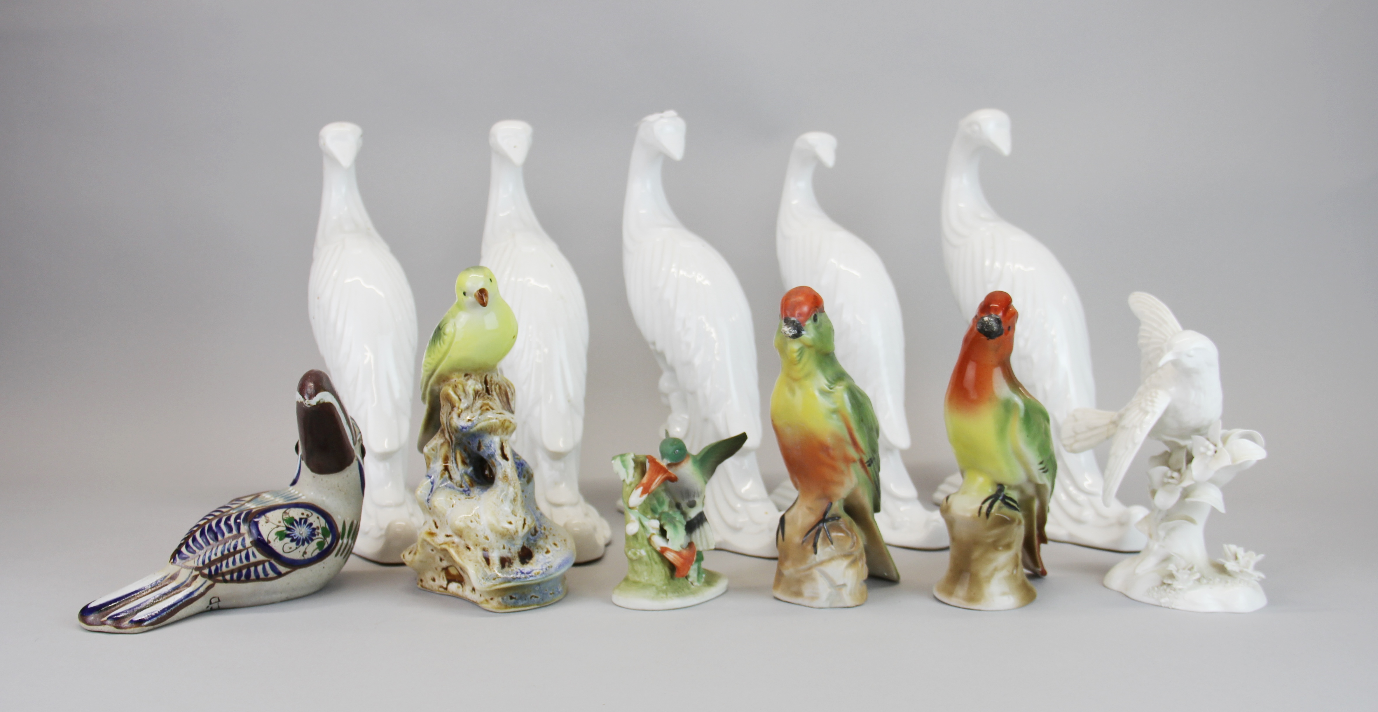 A group of mixed porcelain bird figures, tallest H. 26cm.