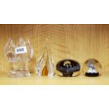 Four good glass paperweights, tallest H. 13cm.
