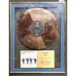 A framed Beatles gold disc for 'Help' frame size 41 x 51cm.