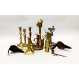 A group of mixed brass, pewter, copper and iron candlesticks, lamps and spout lamps etc tallest H.