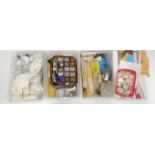 Four boxes containing dolls house building items, including bricks, wall paper, wooden items,