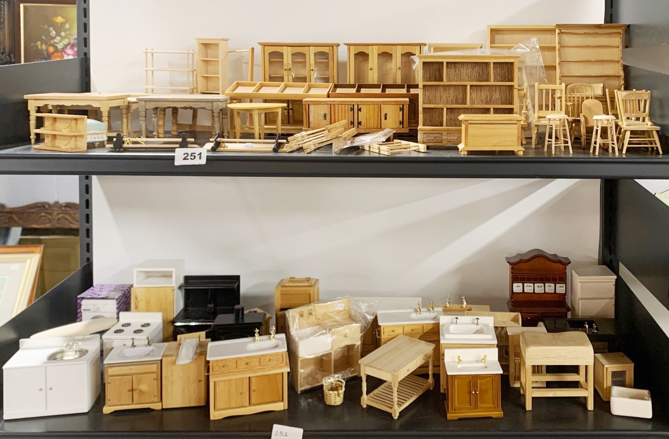 A large quantity of dolls house wooden furniture.