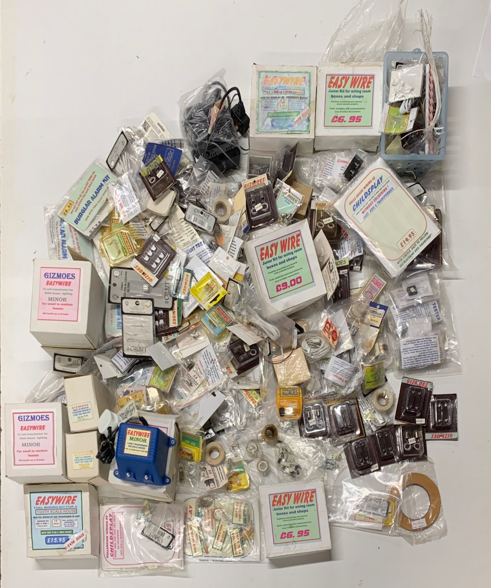 A large quantity of dolls house electrical items, including wires, switches, etc.