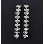 A pair of hallmarked 9ct white gold diamond set drop earrings, approx. 3ct overall, L. 4.5cm.