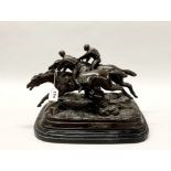 A cast bronze horseracing group figure on a marble base, H. 26cm, W. 42cm.