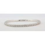 A rare 18ct white gold expandable stretch bangle/bracelet set with 5ct of brilliant cut diamonds,
