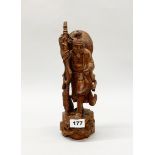 A mid 20th century Chinese carved hardwood figure of a fisherman, H. 31cm.