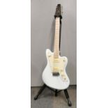 A Revelation RJT 60/12 twelve string electric guitar and stand.