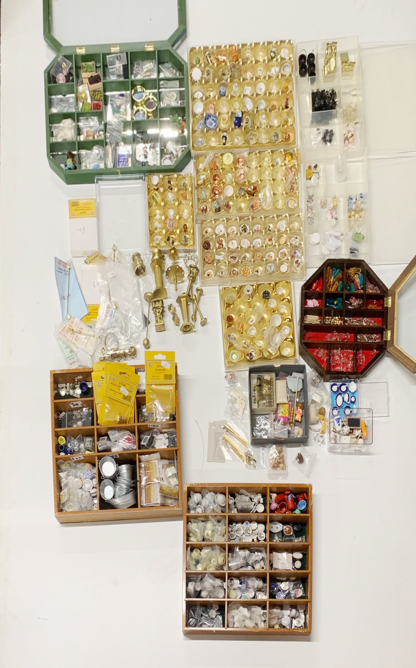 A quantity of boxes and trays containing dolls house smalls and ornaments, including cast metal
