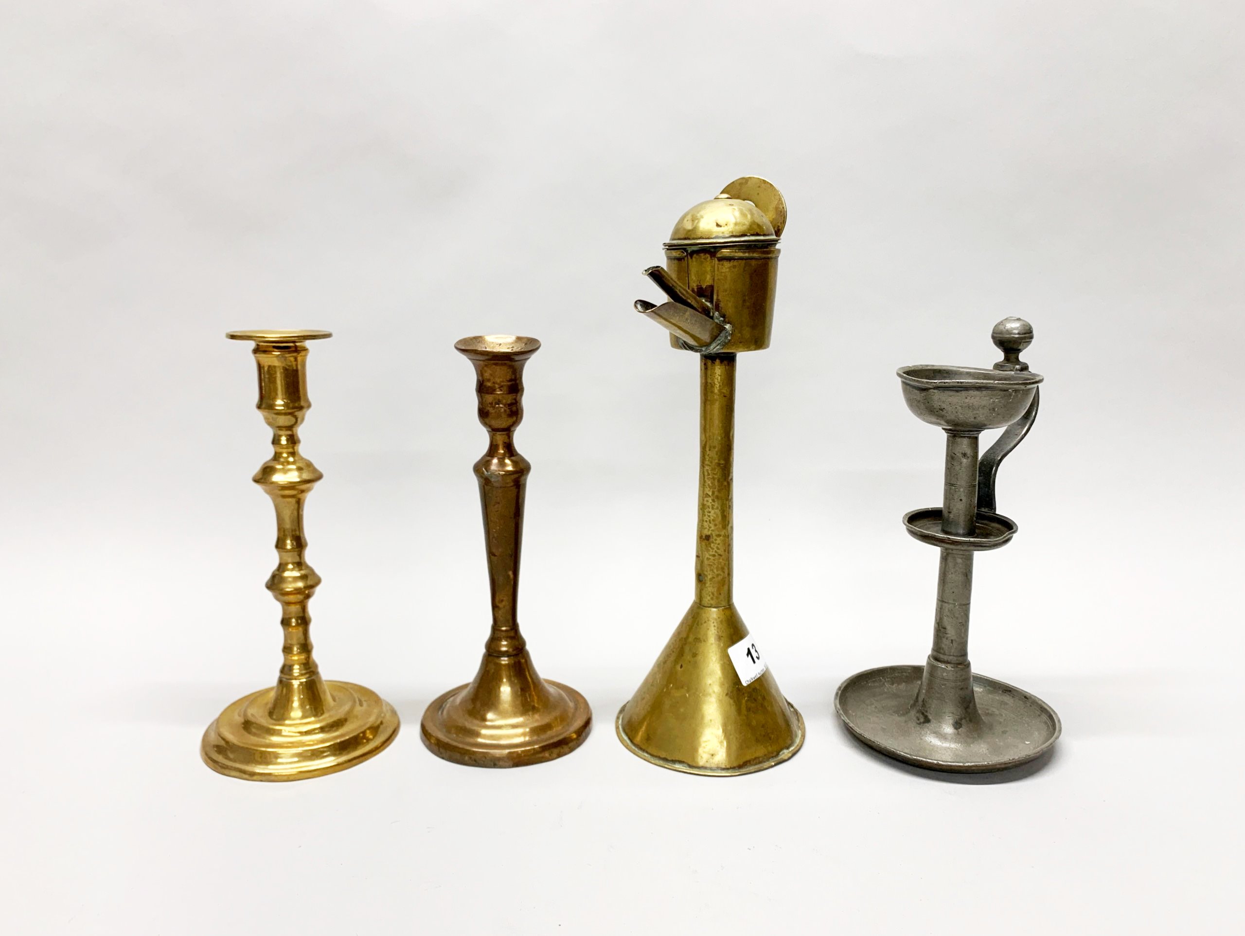 A group of mixed brass, pewter, copper and iron candlesticks, lamps and spout lamps etc tallest H. - Image 2 of 4