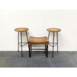 A Lloyd loom metal framed stool and a pair of metal and cane stools with a leather topped drum