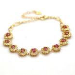 A 925 silver gilt bracelet set with rubies and white stones, L. 21cm.