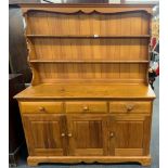 A vintage pine dresser, 134 x 167cm.