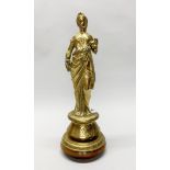 A 19th century brass figure of a woman in classical dress, previously a lamp base, with later turned