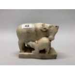 An 18th/ early 19th century Asian carved marble figure of a cow and calf with two female attendants,
