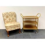 A 1960's gilt tea trolley and nursing chair.