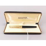 A boxed Sheaffer 14ct gold nib fountain pen.